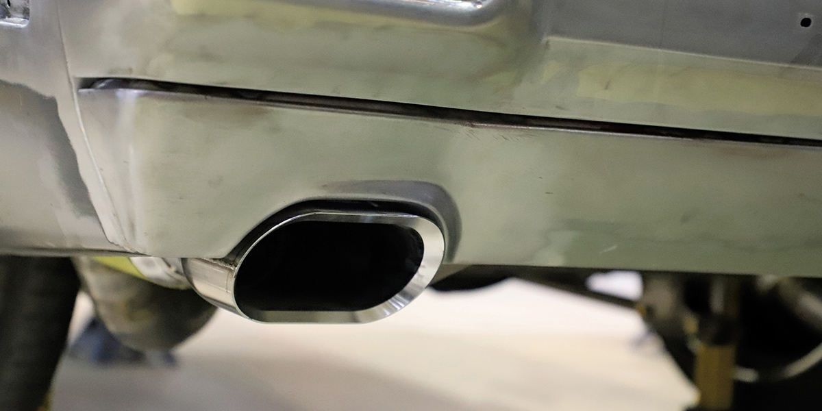 1970 Chevrolet Chevelle - Exhaust Detail Close-up of a silver 1970 Chevelle's rear bumper