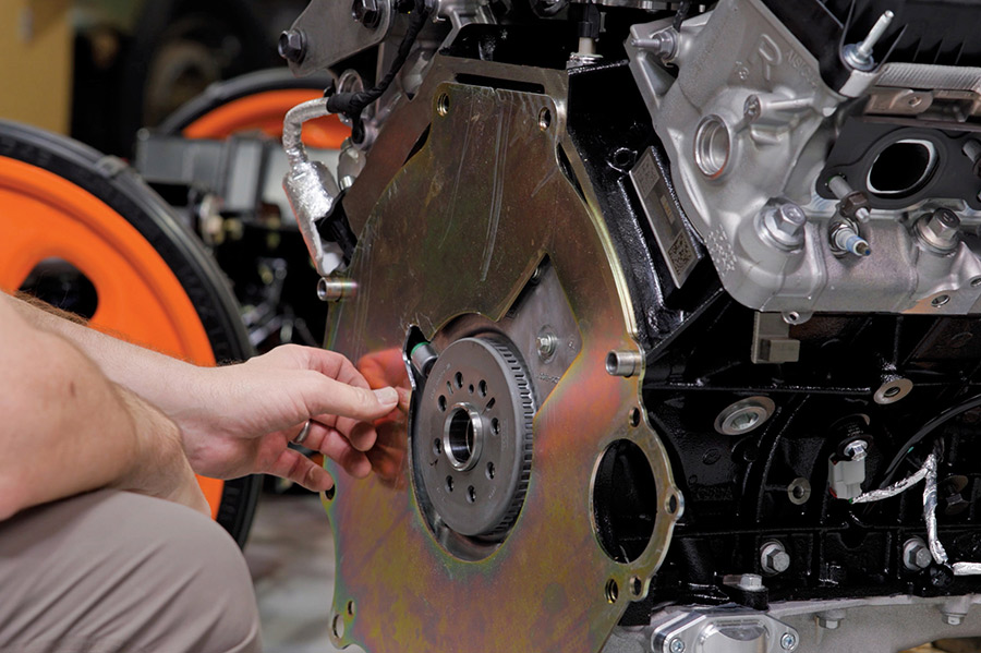 Installing the engine block-off plate prior to clutch assembly