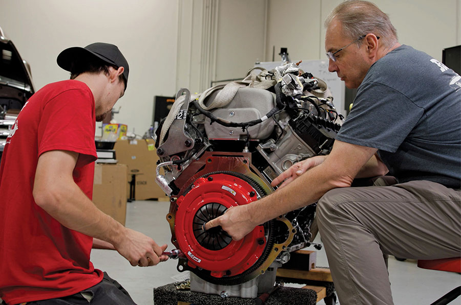 Bolting the clutch pressure plate to the flywheel assembly