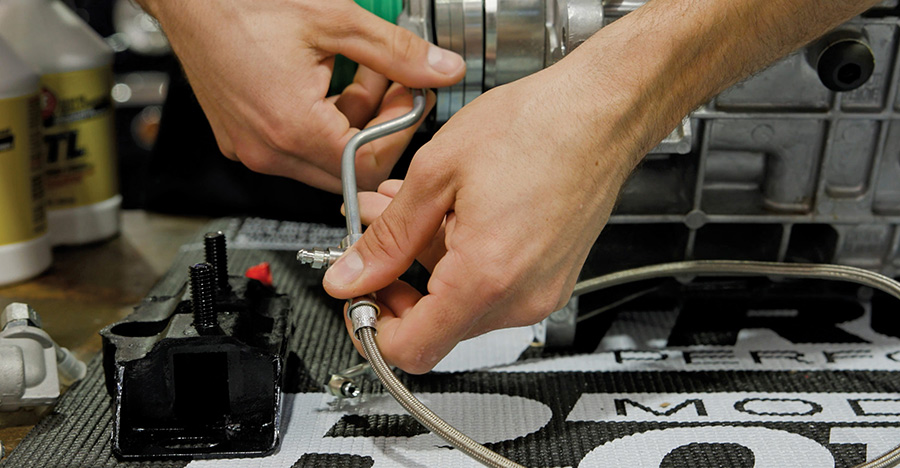 Connecting hydraulic lines and checking bellhousing alignment holes