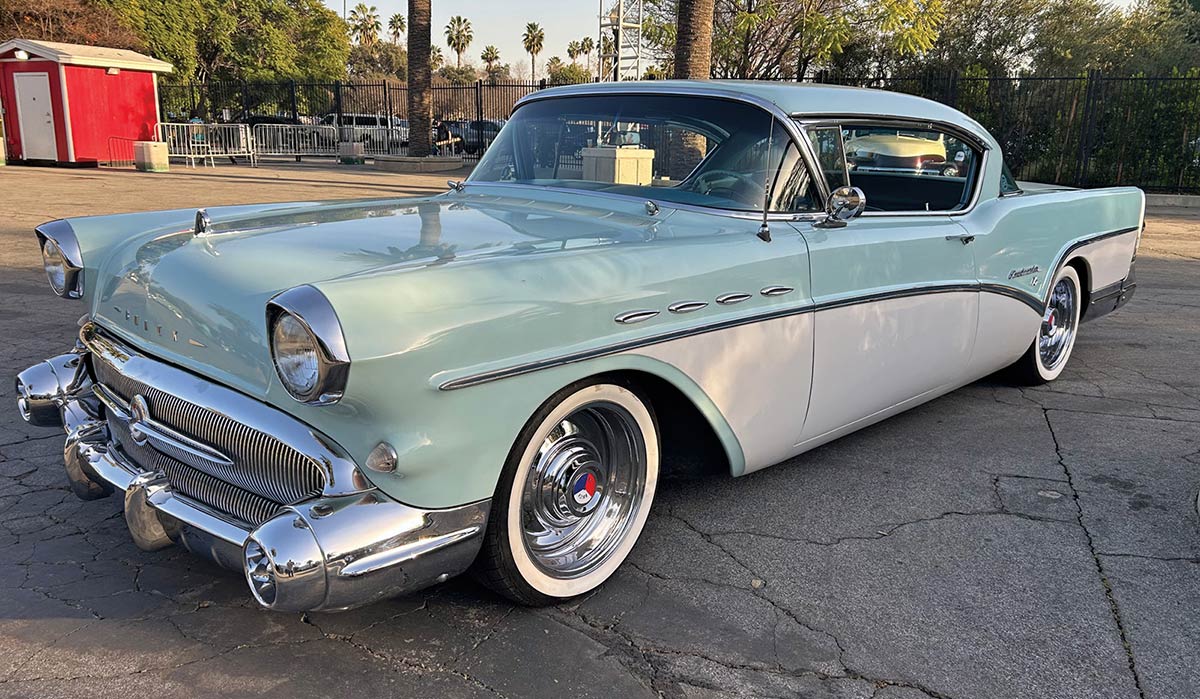 1957 Buick Special silver black two-door hardtop whitewall tires chrome tailfins asphalt