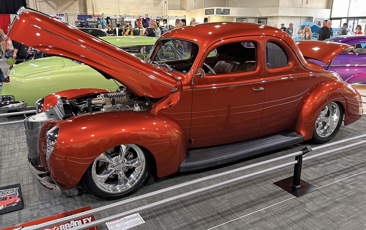 1941 Willys Coupe copper custom lowered chrome hood open indoor car show build