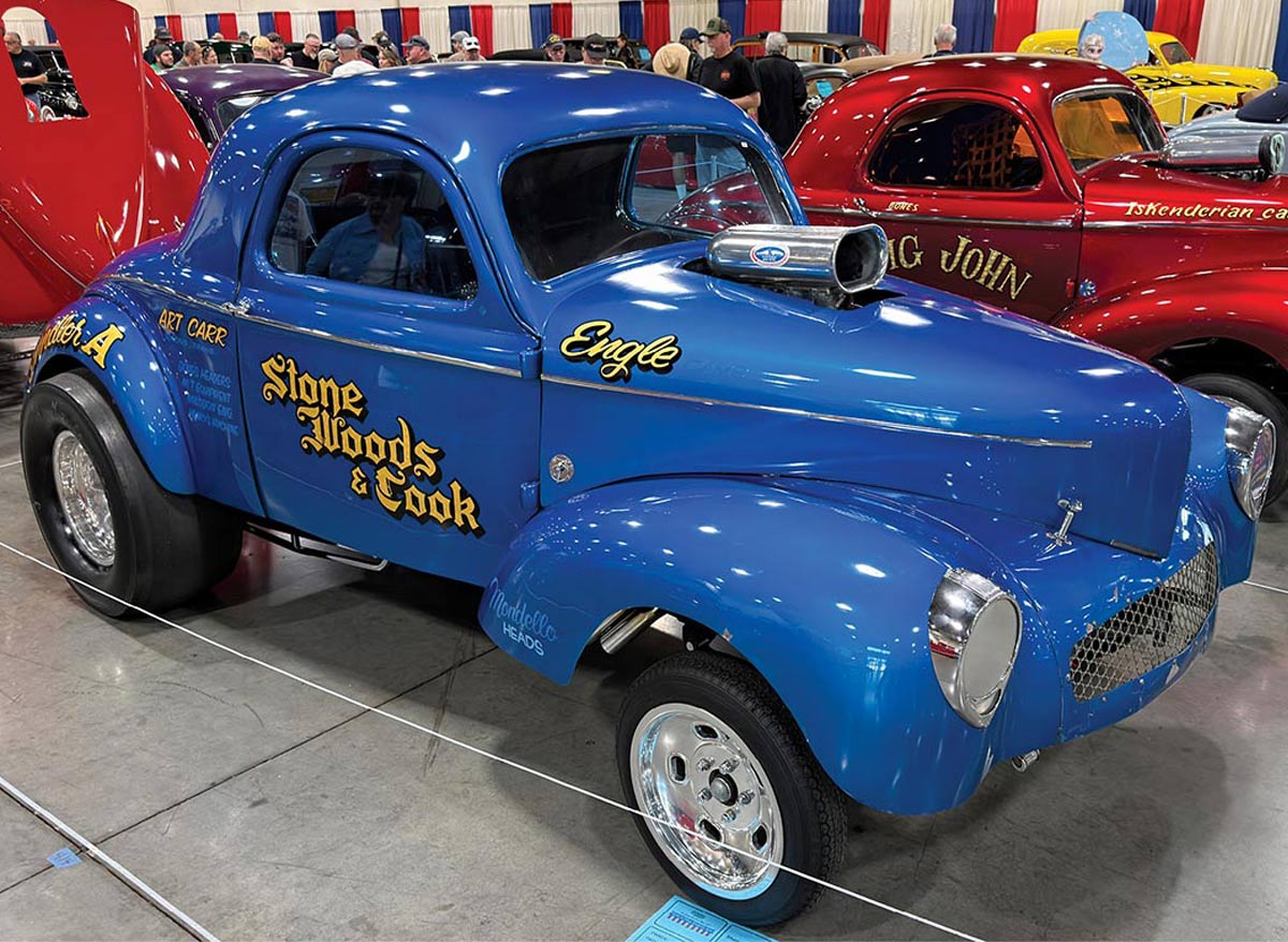 1948 Ford Coupe vibrant blue modified with a lowered stance and custom paint