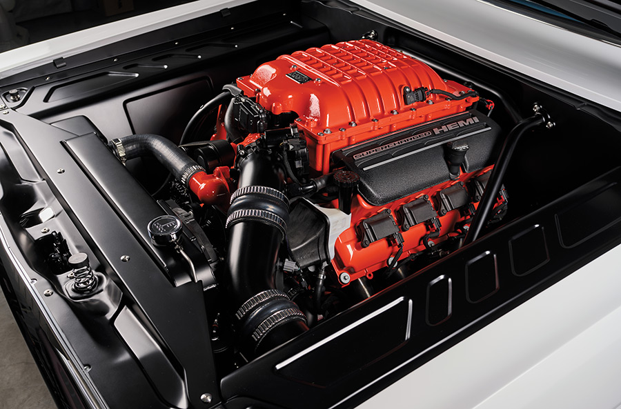 Supercharged 6.2L Hellcat engine finished in bright orange paint.