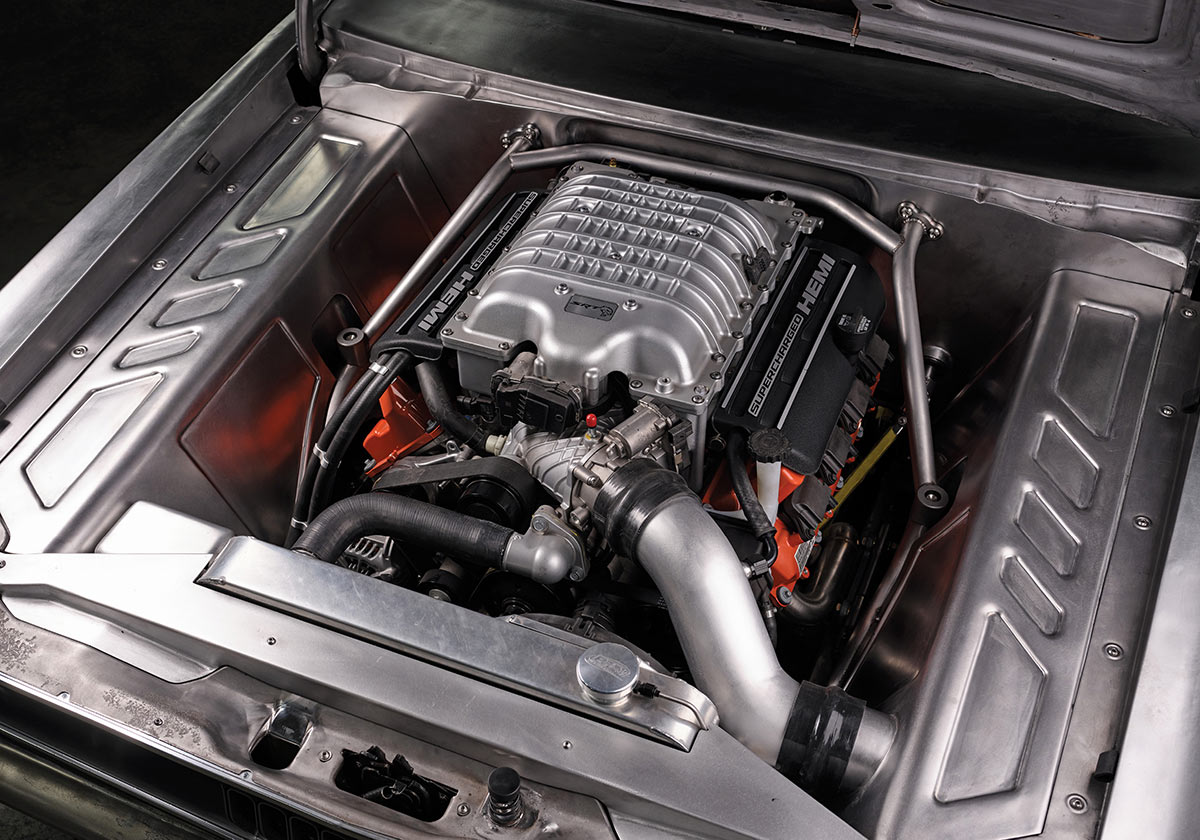 Supercharged Hemi engine trial fit in the raw metal bay.
