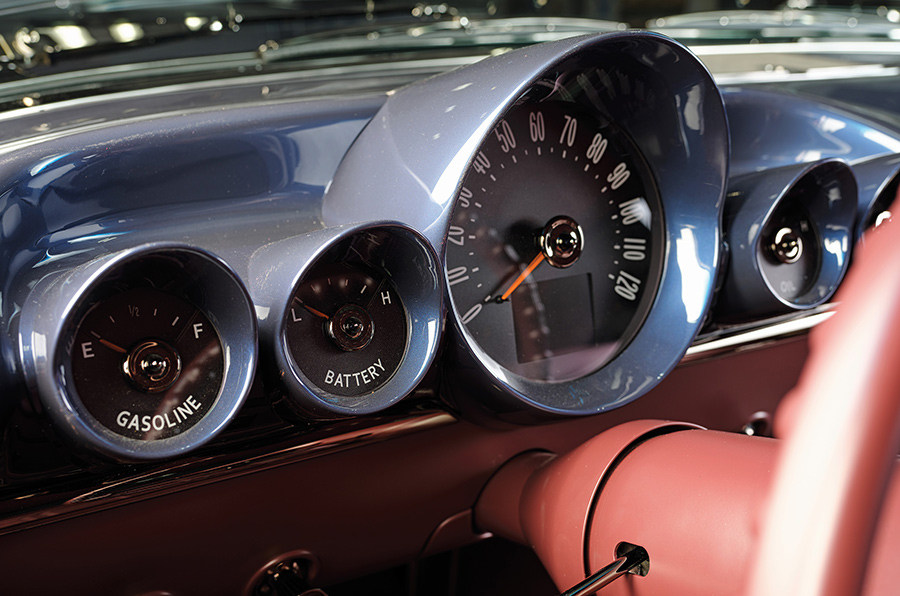 Detailed view of Dakota Digital gauges in a blue dashboard.