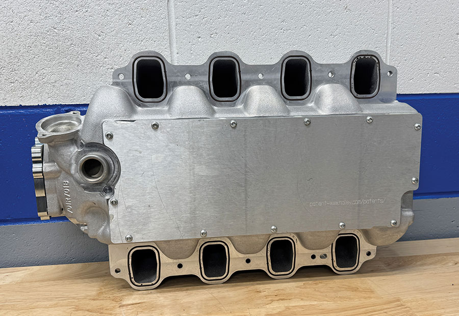 Underside of the intake manifold showing the removable access plate.