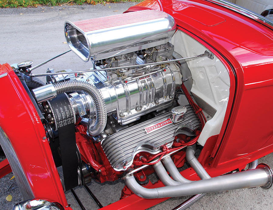 Supercharged 409 with twin Edelbrock carburetors.