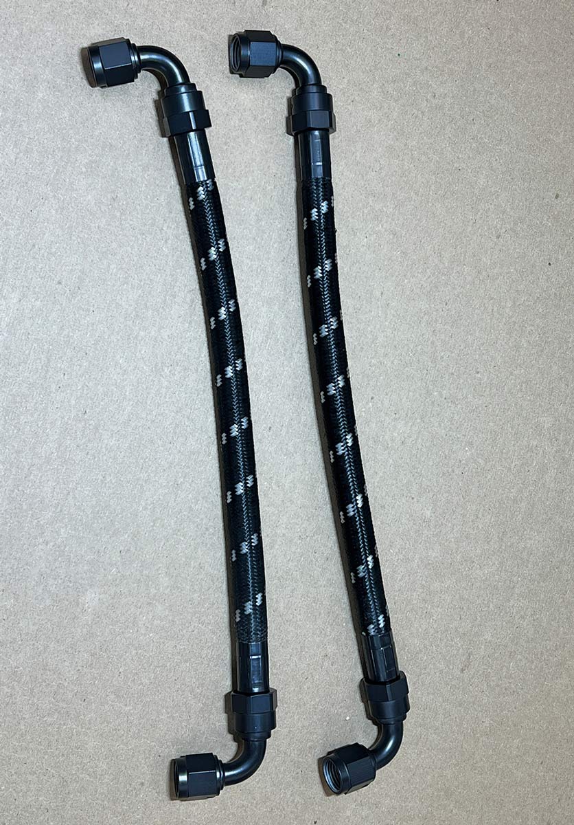 Custom braided AN power steering hoses with fittings.