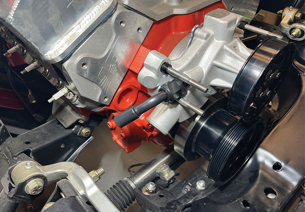 Beadlock heater hose fitting installed on water pump.