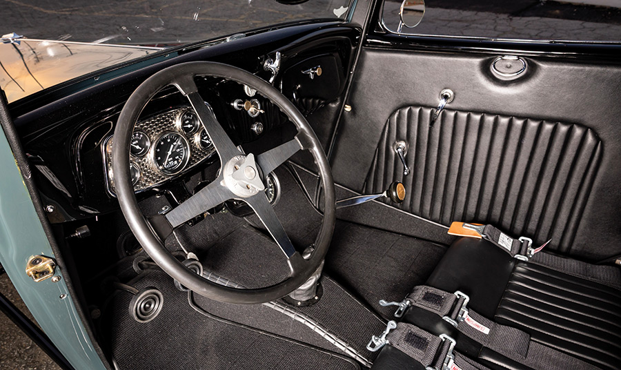 Driver's side interior view including steering wheel and shifter.