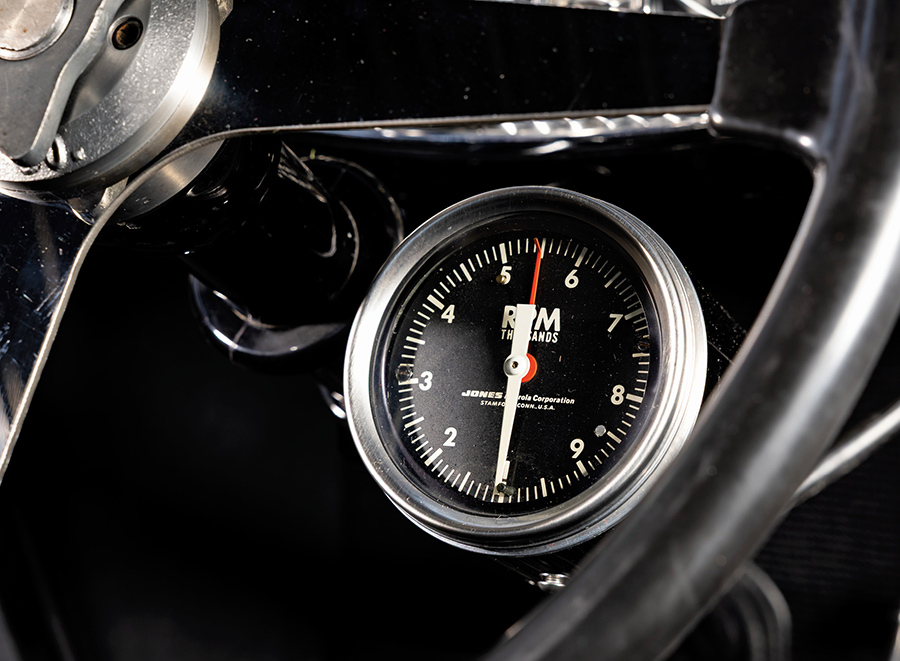 Jones mechanical tachometer mounted to the steering column.