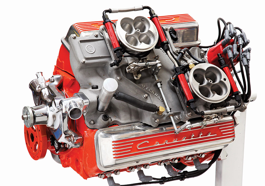 327 small-block Chevy engine with cross-ram intake.