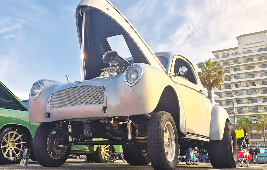 Silver 1940 Willys gasser with a high nose stance