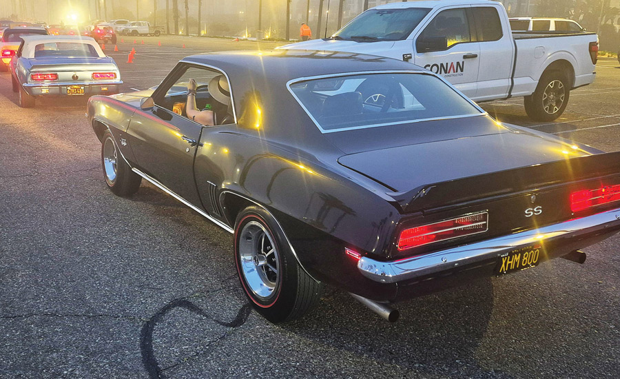 Black 1969 Chevrolet Camaro SS driving through morning fog