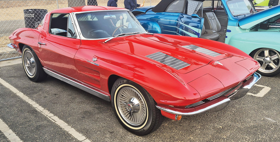 Red 1963 Chevrolet Corvette split-window coupe parked outdoors