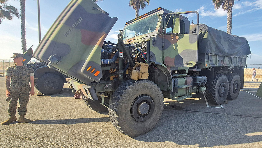 Large USMC camouflage MTVR truck with its hood open