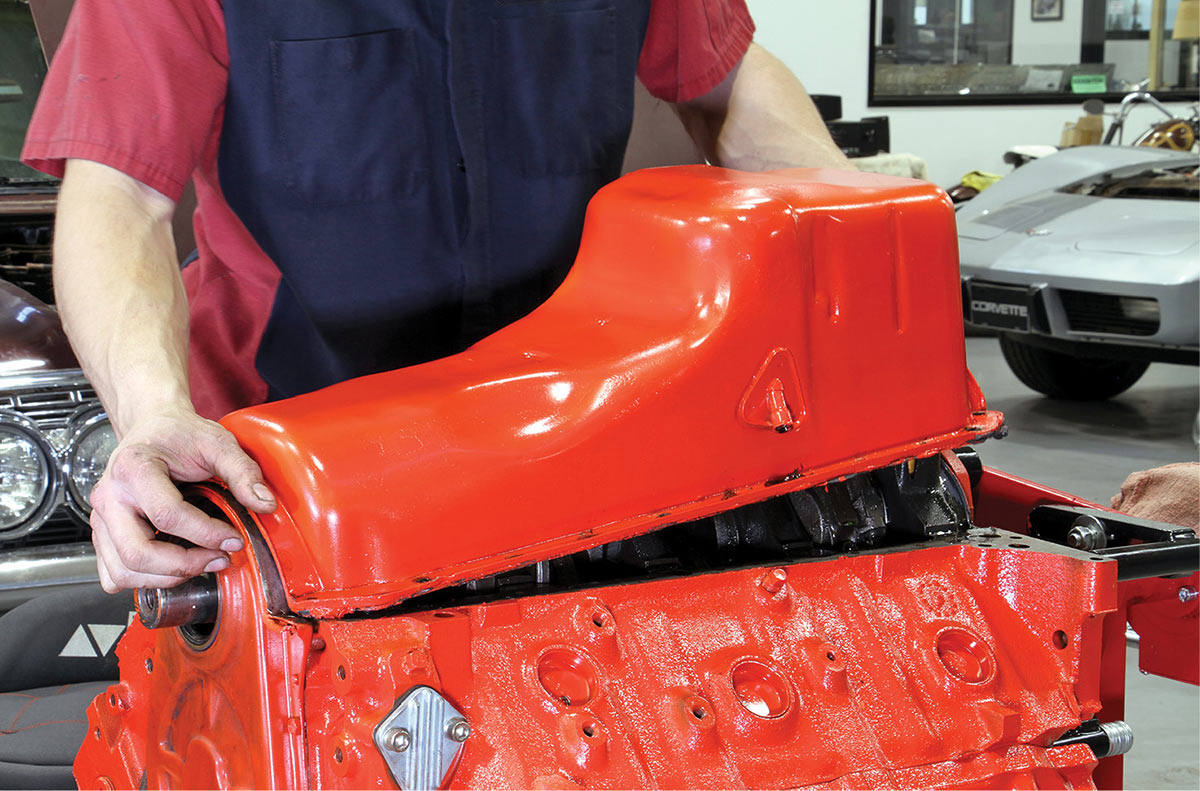 Big-block Chevy engine being removed for inspection.