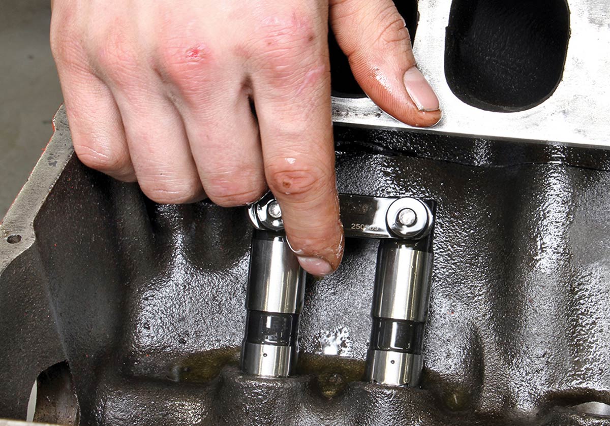 Honing engine lifter bores for smooth lifter operation.
