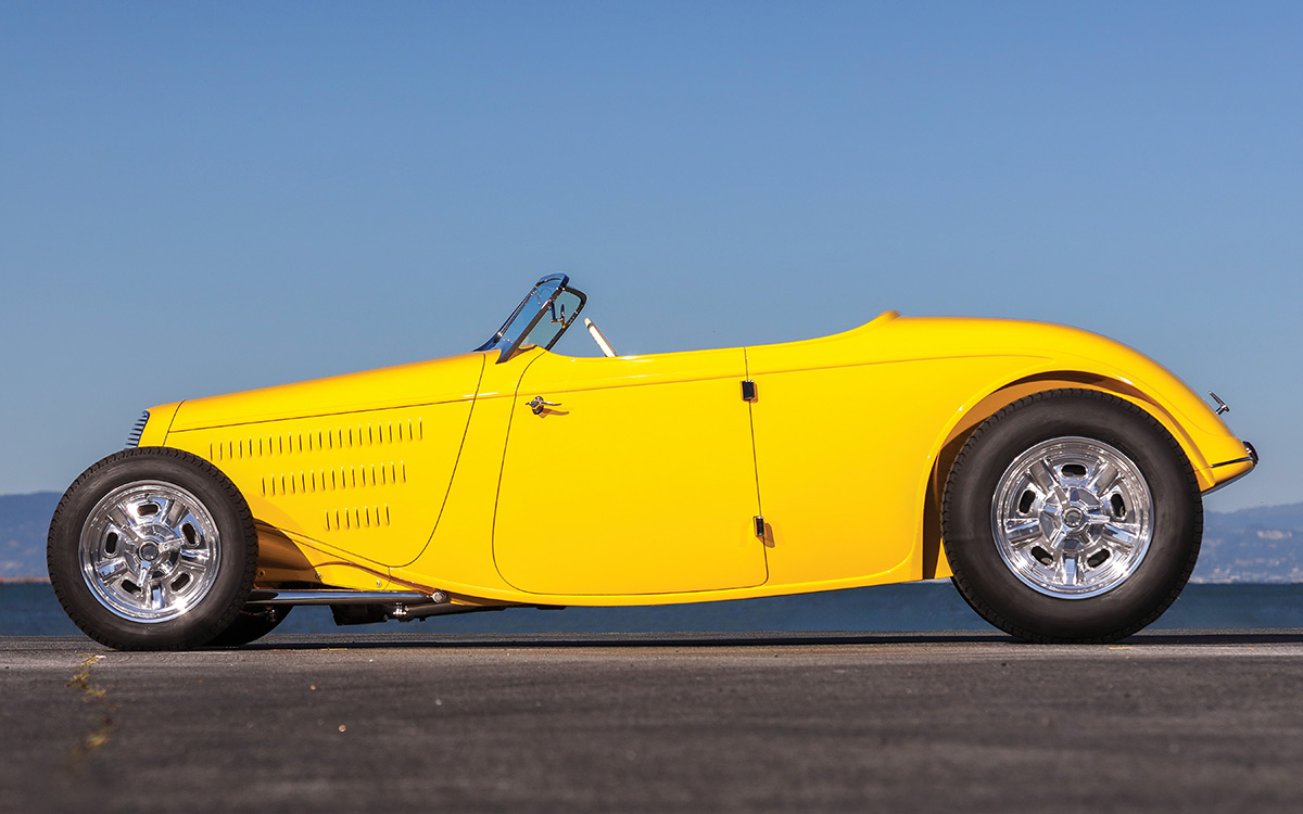 Side profile of the yellow 1934 Ford roadster lowboy.
