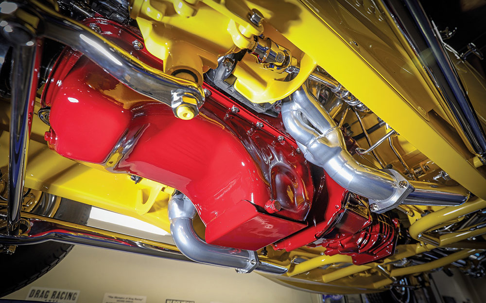 Underside view of red engine and boxed frame.