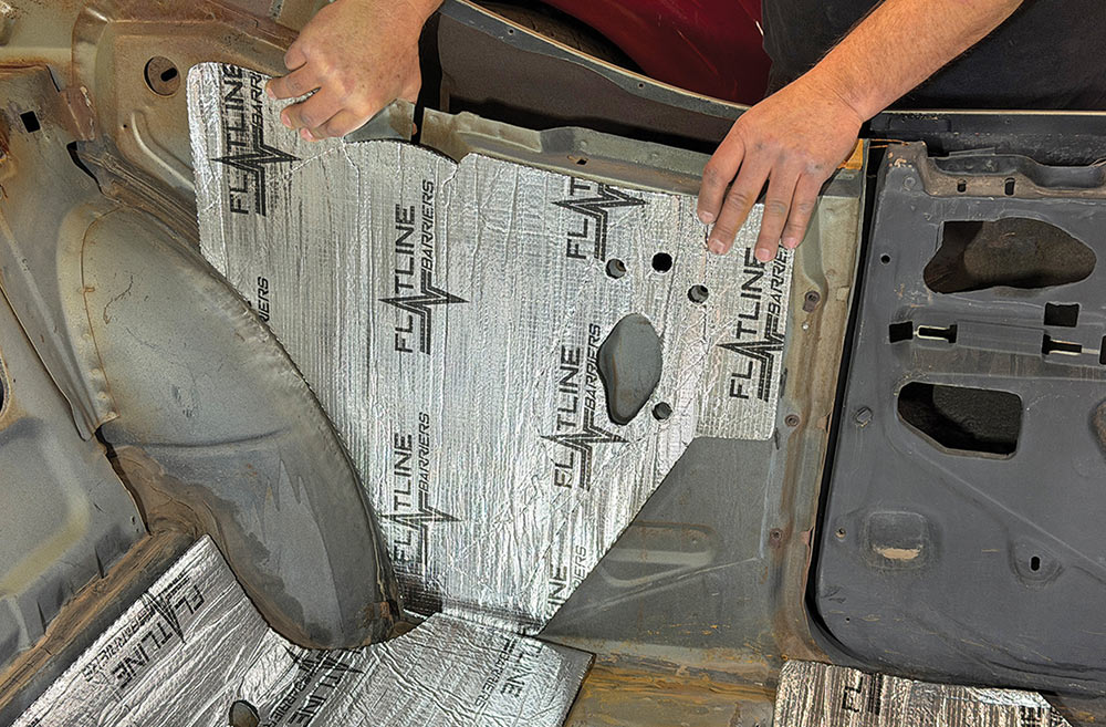 Aligning insulation panel on an interior door skin.