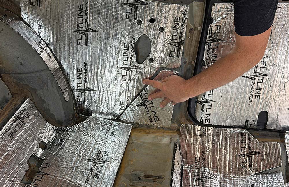 Final adjustment of a rear passenger side insulation panel.