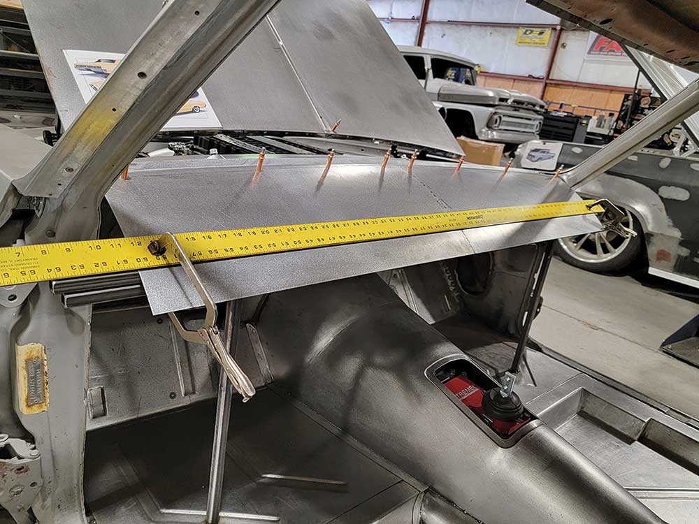 Marking a bend line on sheet metal with a straightedge.
