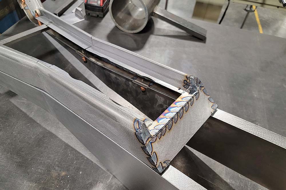 Back cap welded to upper console section.