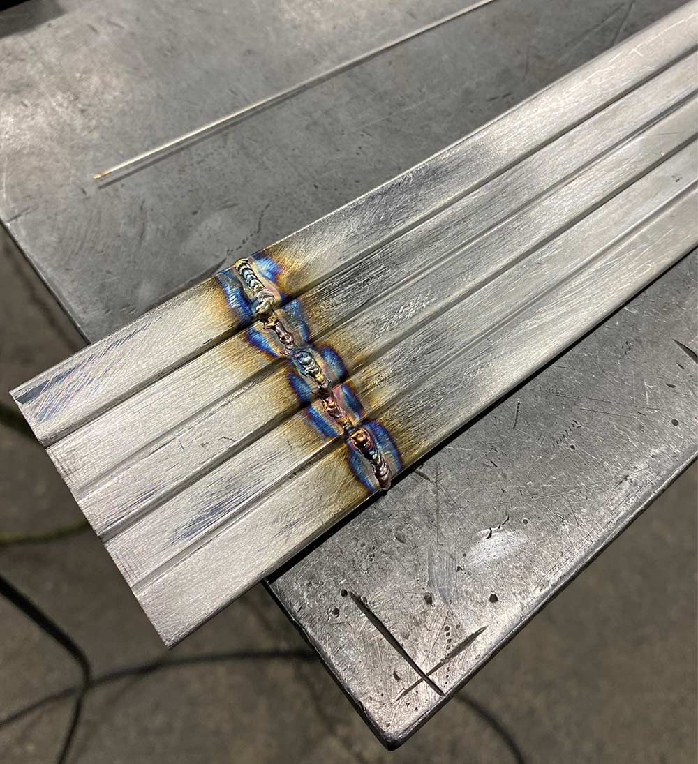 Close-up of TIG-welded seams on the custom stainless steel trim.