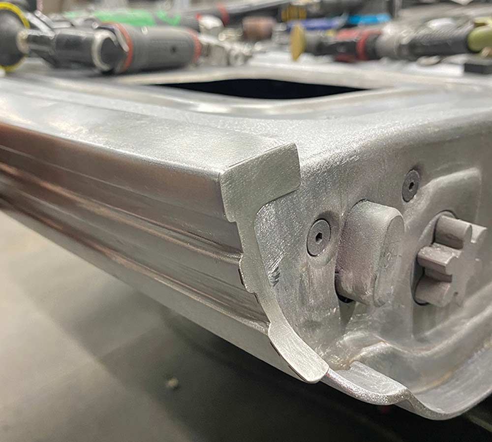 Detail of a new flanged end corner-welded onto the stainless trim.