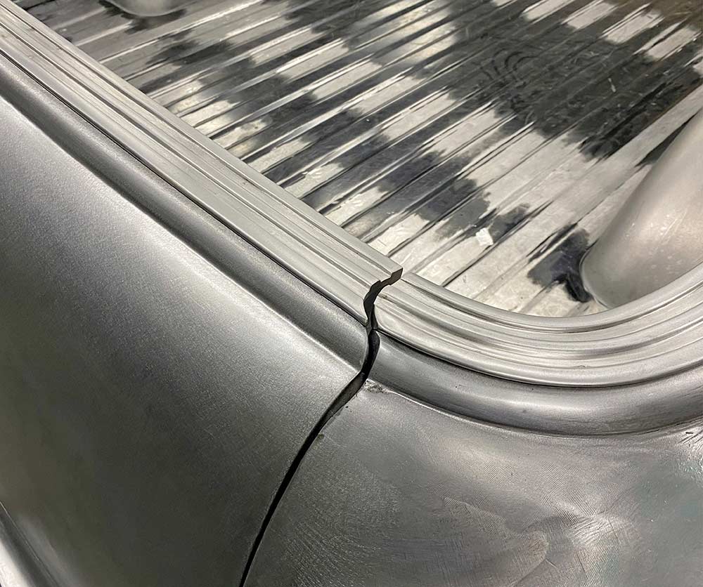 Fitment gap between the cab trim and the adjacent bed trim.