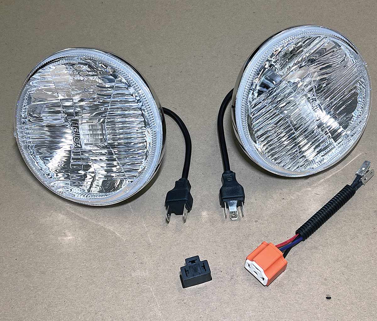 Holley RetroBright LED headlamps and adapter harness assembly.