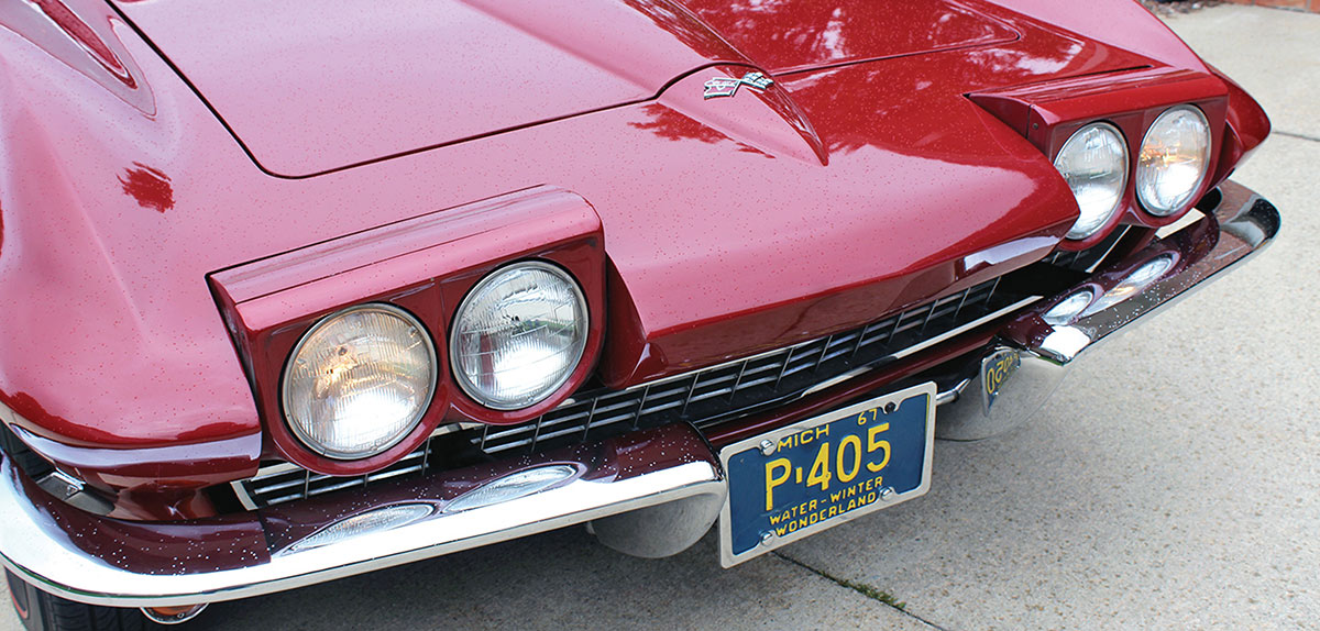 C2 Corvette hidden headlight assembly with lights open.