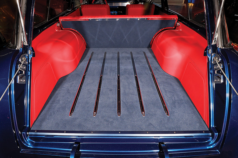 Detailed view of the rear cargo floor with wood-style slats.