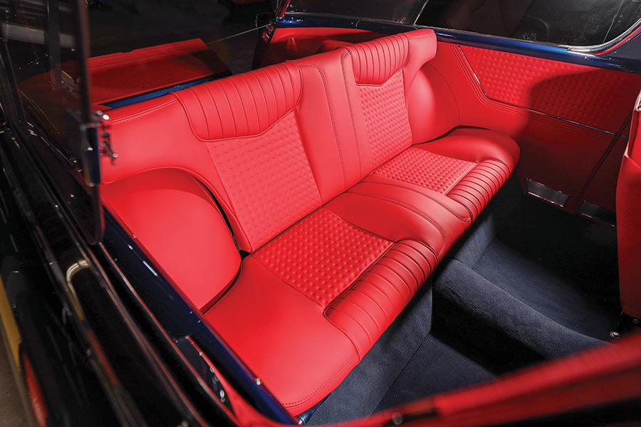 Custom red leather folding rear bench seat.