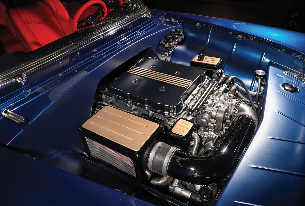 Supercharged LT4 engine assembly in a custom-painted engine bay.