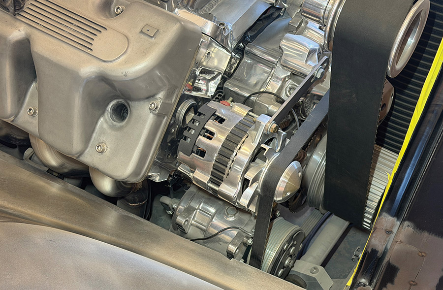 Detail view of the custom belt drive system and high-output alternator.