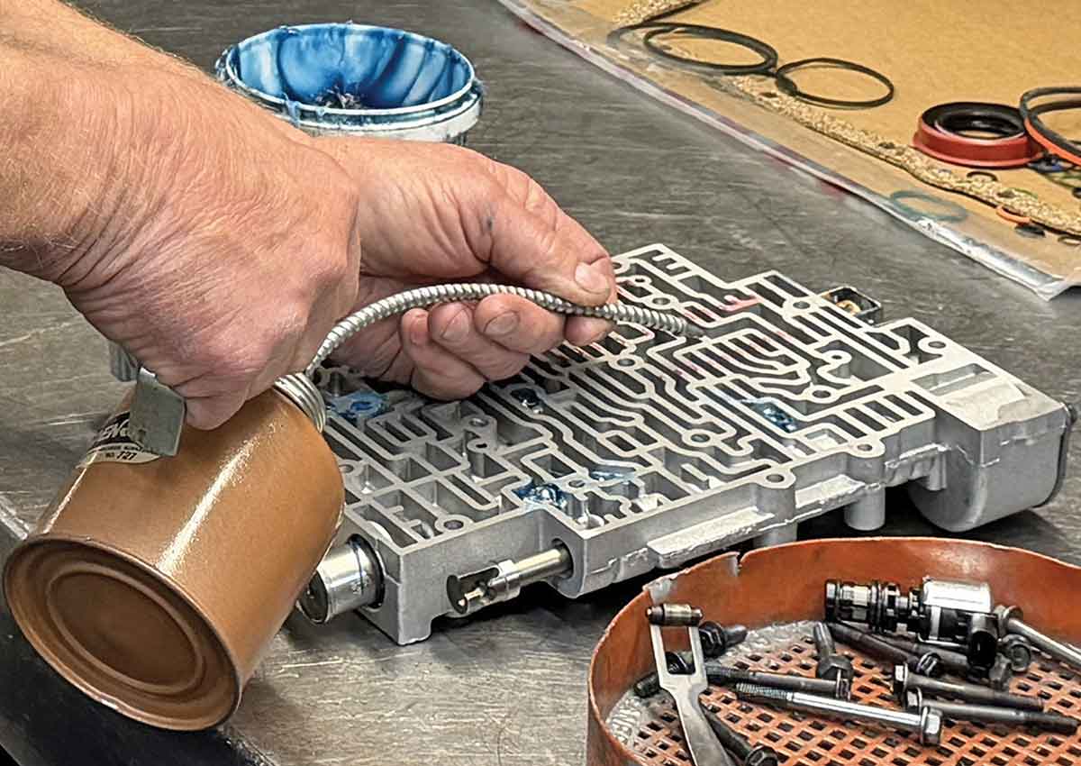 Applying assembly lube to valvebody valves.