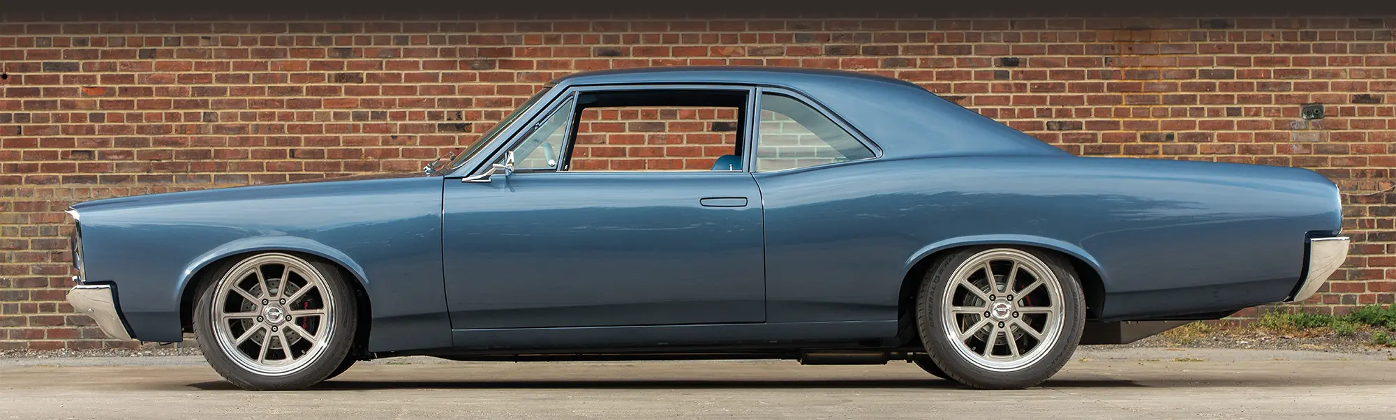 Side profile of the blue 1966 Pontiac Tempest.