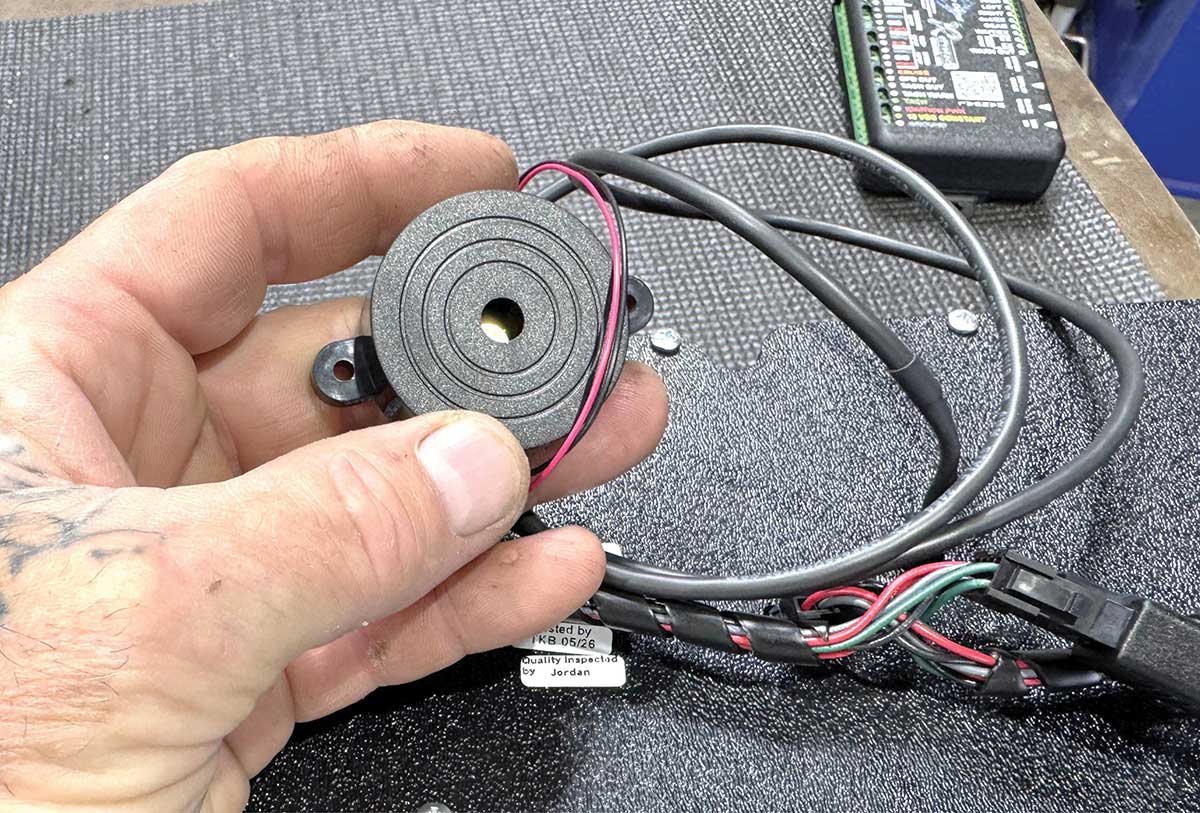 Warning buzzer and harness module for instrument panel installation.