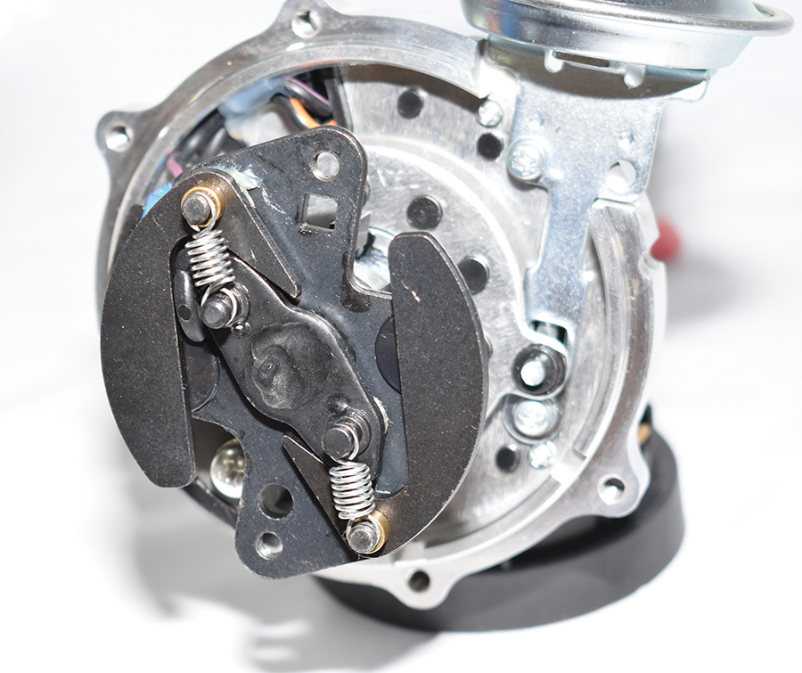 Centrifugal advance weights and springs inside a distributor.