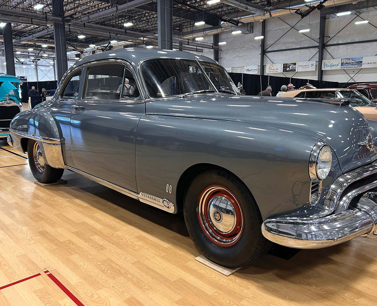 Gray 1949 Oldsmobile 88 sedan with red wheels