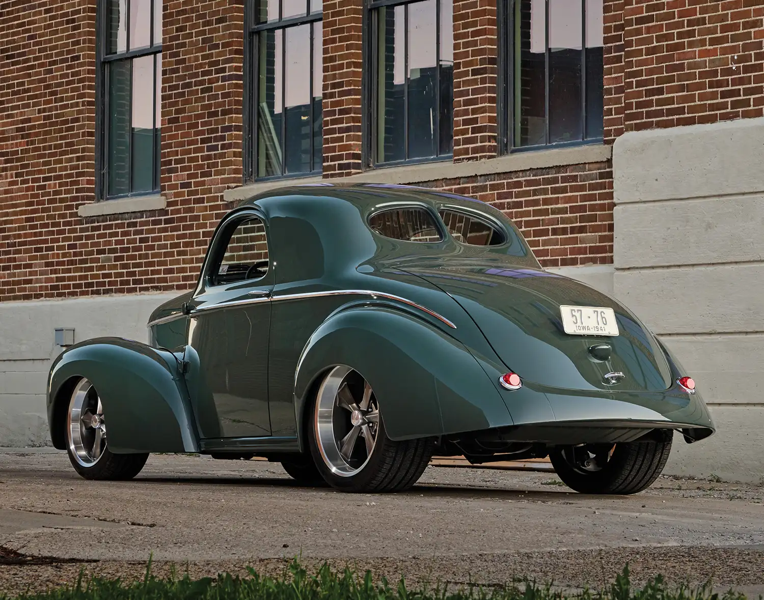 Rear view of green Willys showing sleek body lines