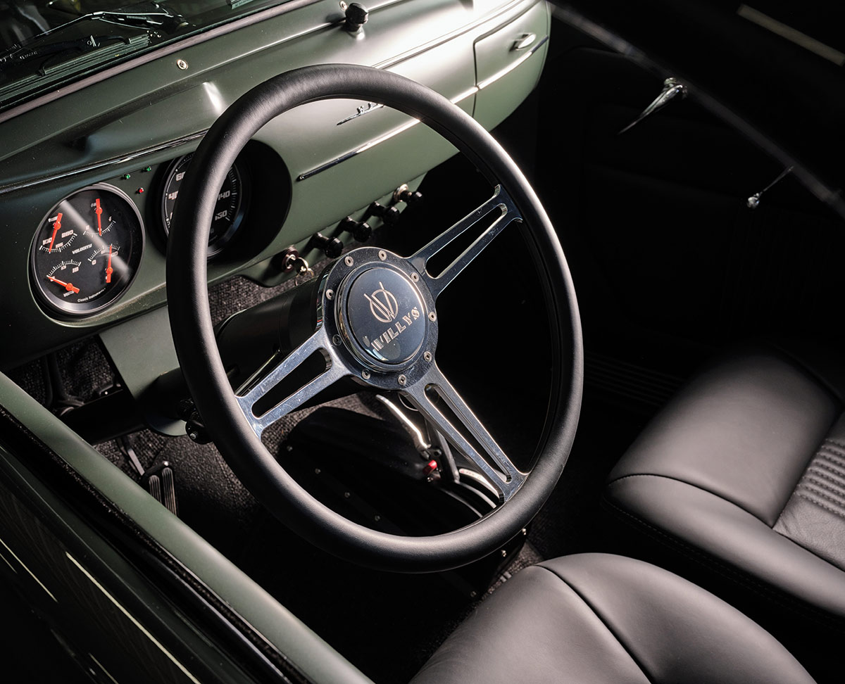 Interior view with steering wheel and custom dashboard