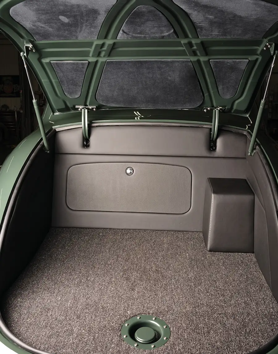 Fully upholstered trunk area with recessed fuel cap