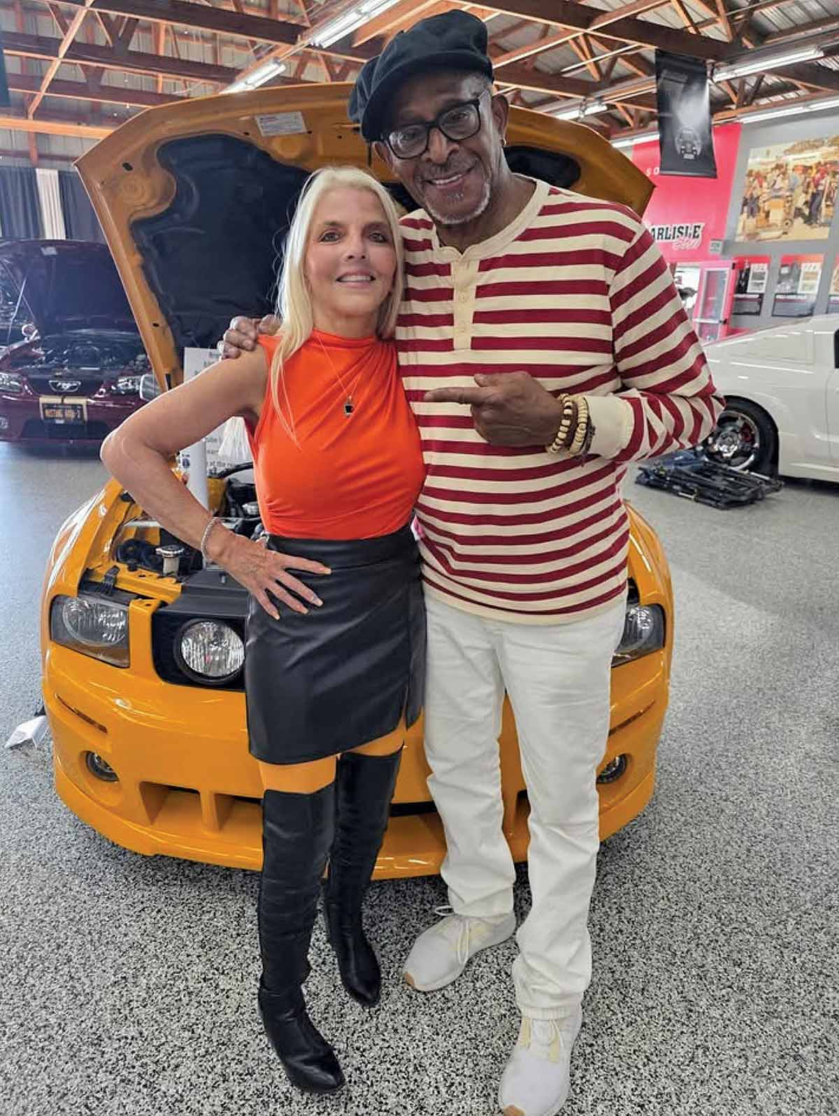 Antonio Fargas standing with owner of Roush Mustang.