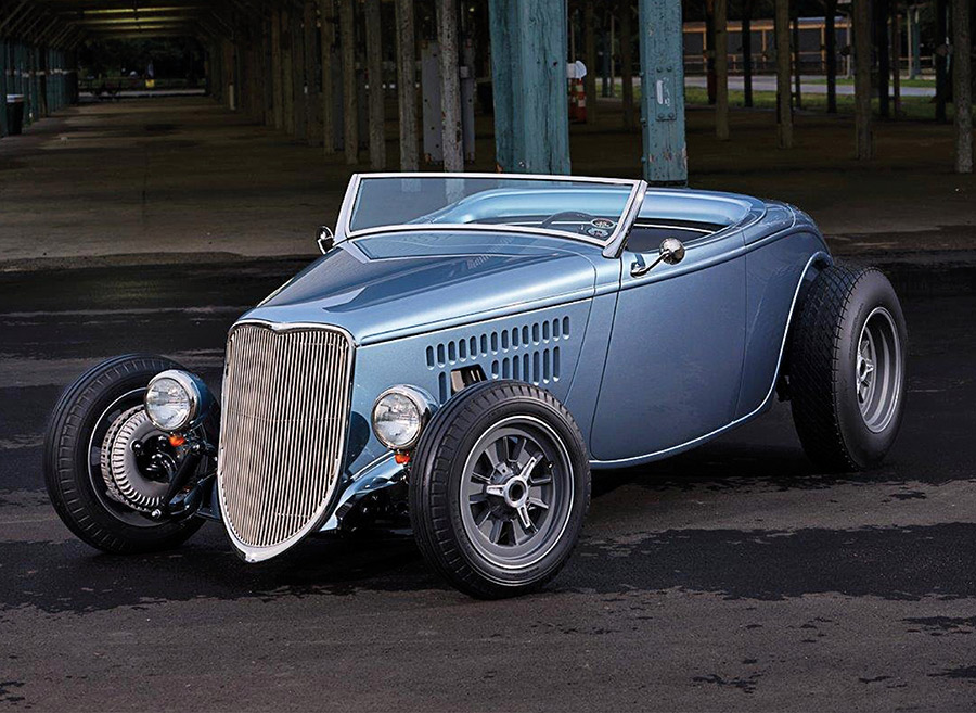 Front three-quarter view of a blue 1933 Ford roadster.