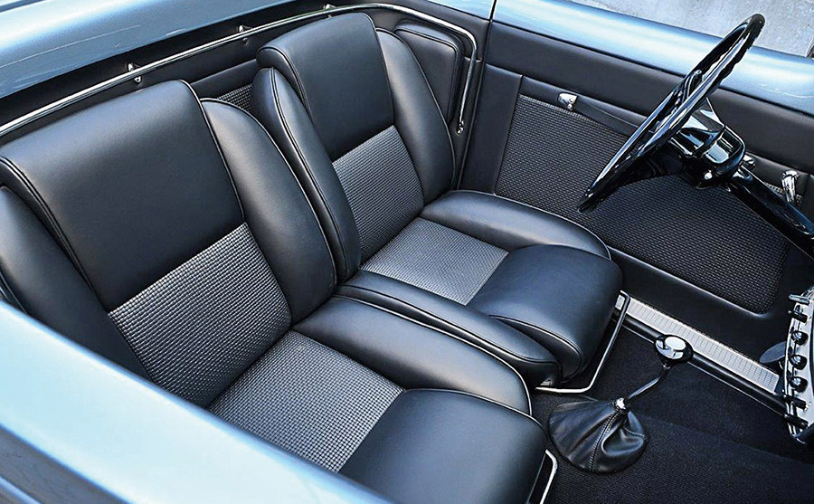 Detailed view of the custom black leather interior of the Fairleigh roadster.