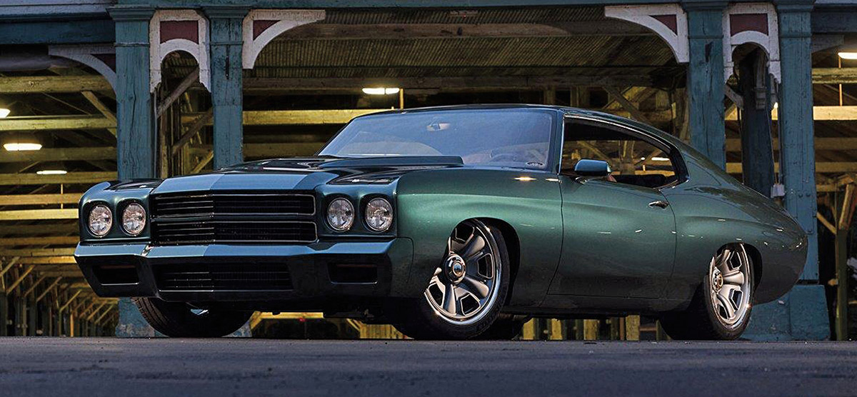 Front three-quarter profile of a dark green 1970 Chevelle street machine.